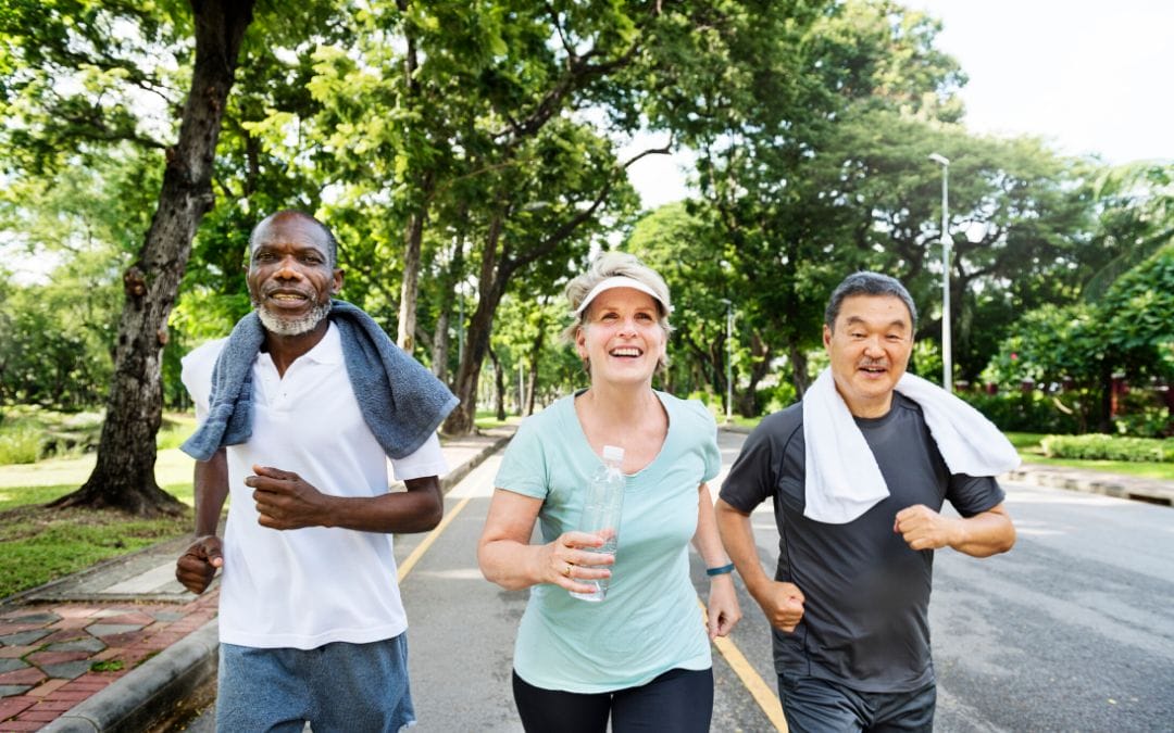 Group of seniors jogging outside together