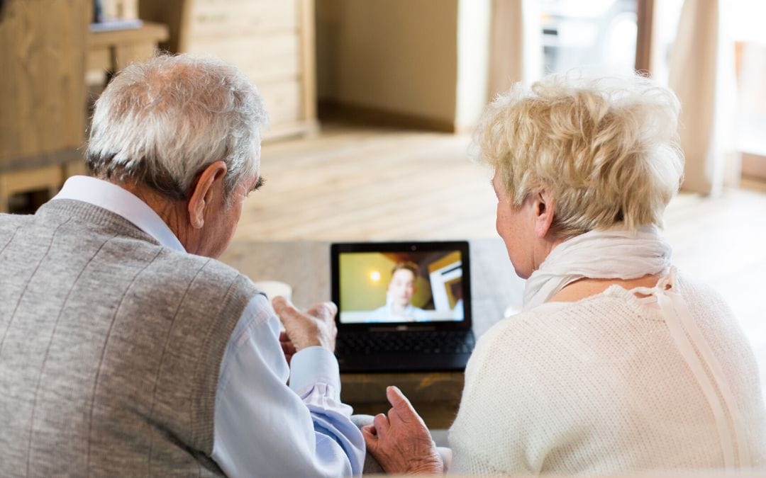 Senior couple on video call with young person