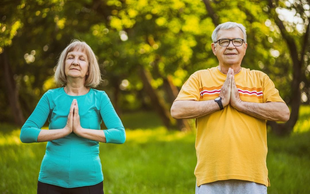 Senior couple meditating