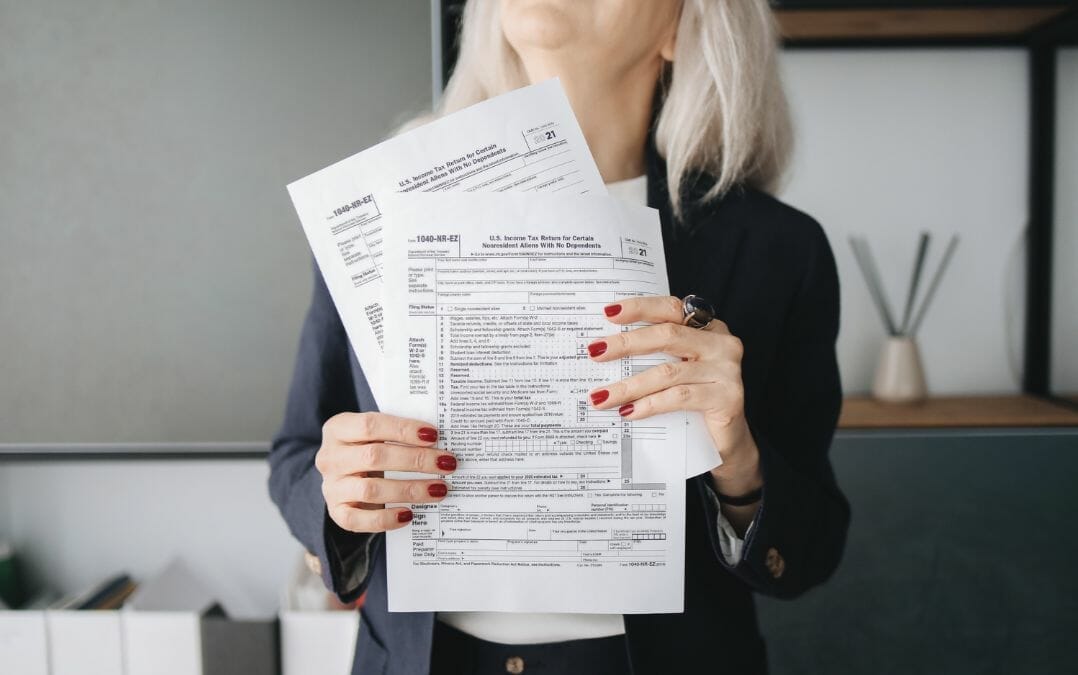 Senior woman holding tax documents